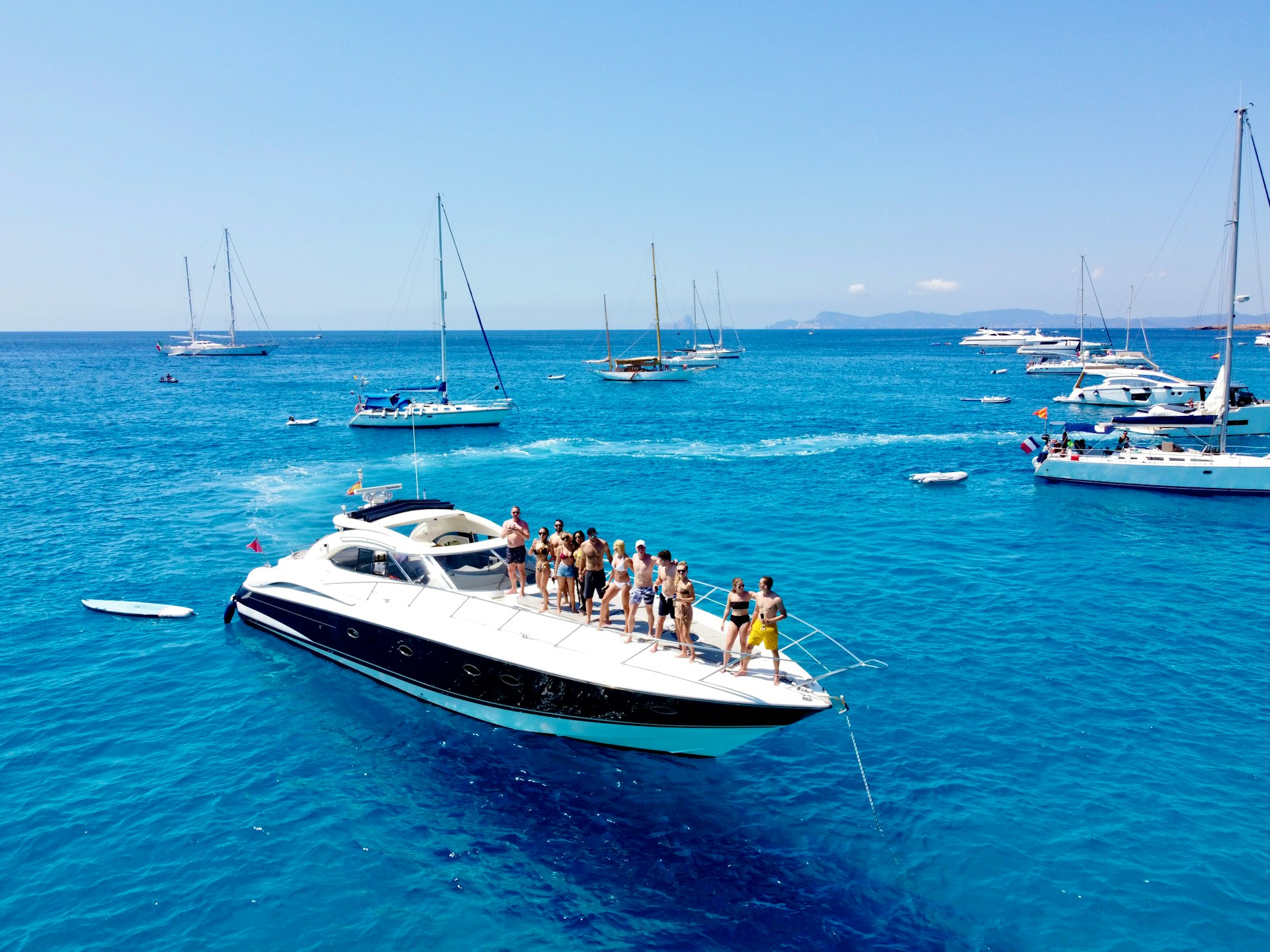 a group of people on a boat in the ocean